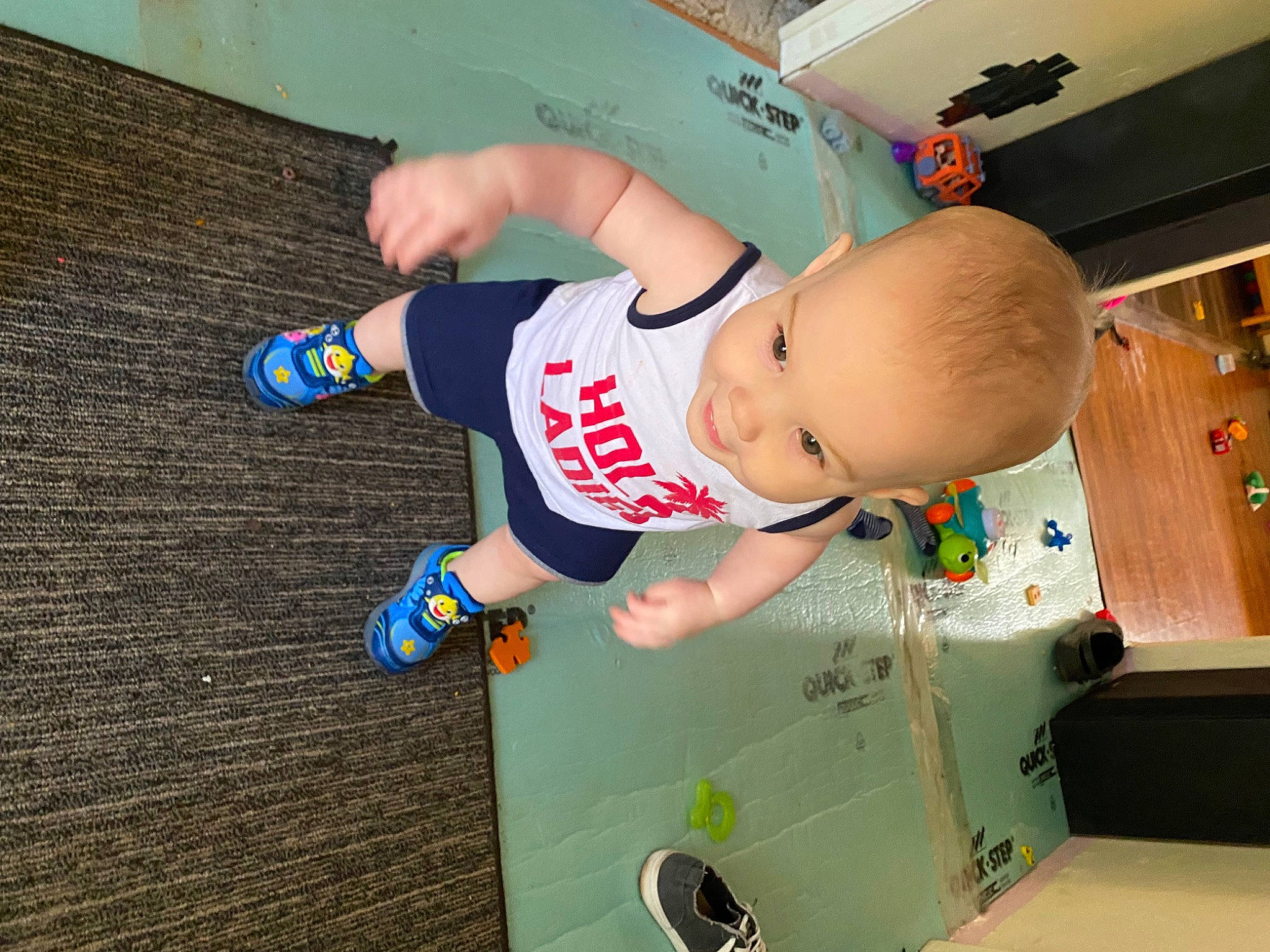 Jensen joined the competition — help win amazing prizes! arm, baby, baby_products, baby_safety, baby_toddler_clothing, child, elbow, flooring, fun, hat, human_leg, knee, person, play, room, smile, sock, t_shirt, thigh, toddler