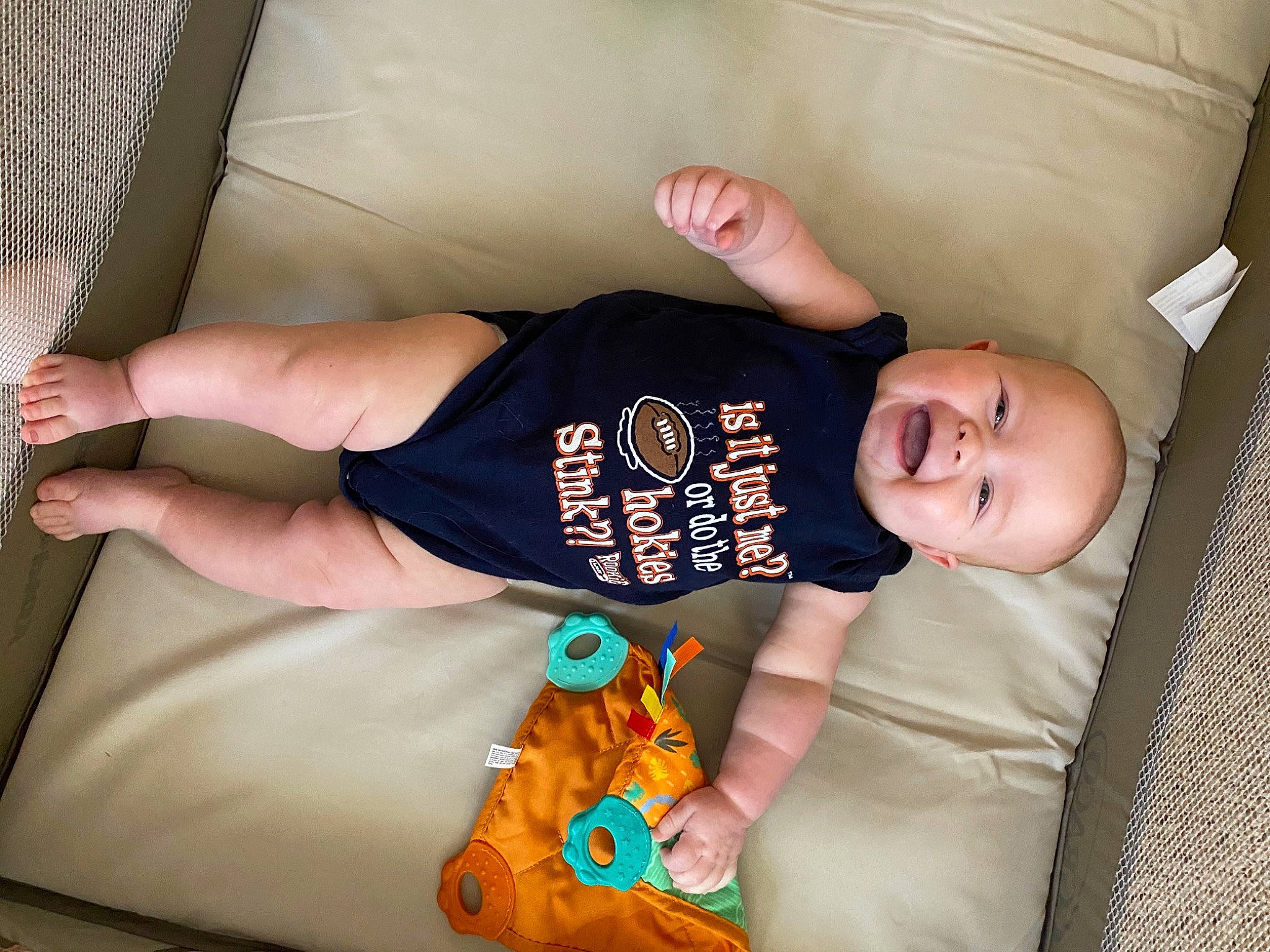 Jase joined the competition — help win amazing prizes! baby, baby_products, baby_toddler_clothing, chair, child, comfort, couch, elbow, finger, flooring, fun, linens, orange, person, room, sitting, sleeve, smile, t_shirt, toddler