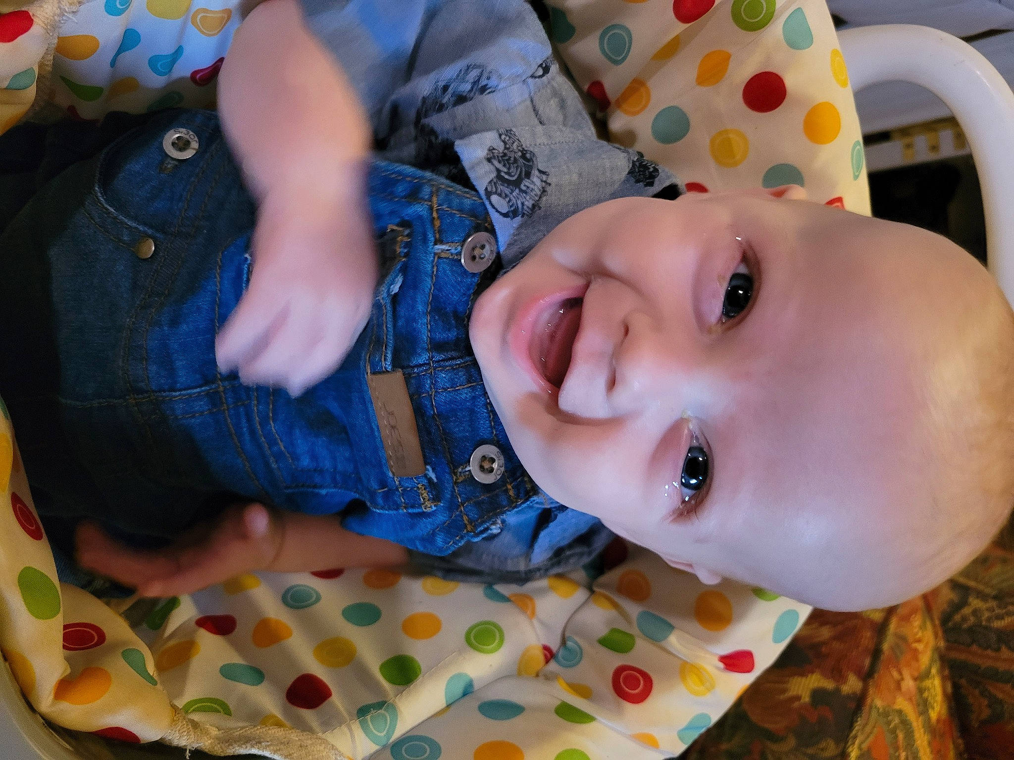 Atlas is registered to the contest to win money with this photo: arm, baby, baby_toddler_clothing, blue, cheek, chin, eye, face, hand, happy, head, human_body, iris, lip, mouth, nose, person, skin, sleeve, smile