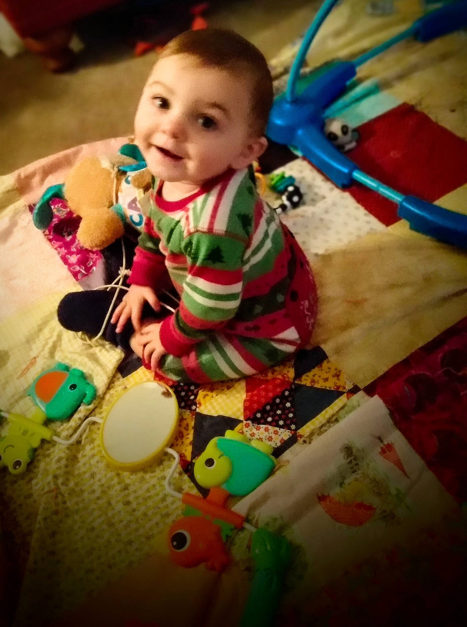 Eric is registered to the contest to win money with this photo: baby, baby_products, baby_toddler_clothing, baby_toys, cheek, child, flooring, fun, happy, head, holiday, person, play, sitting, skin, smile, stuffed_toy, t_shirt, toddler, toy