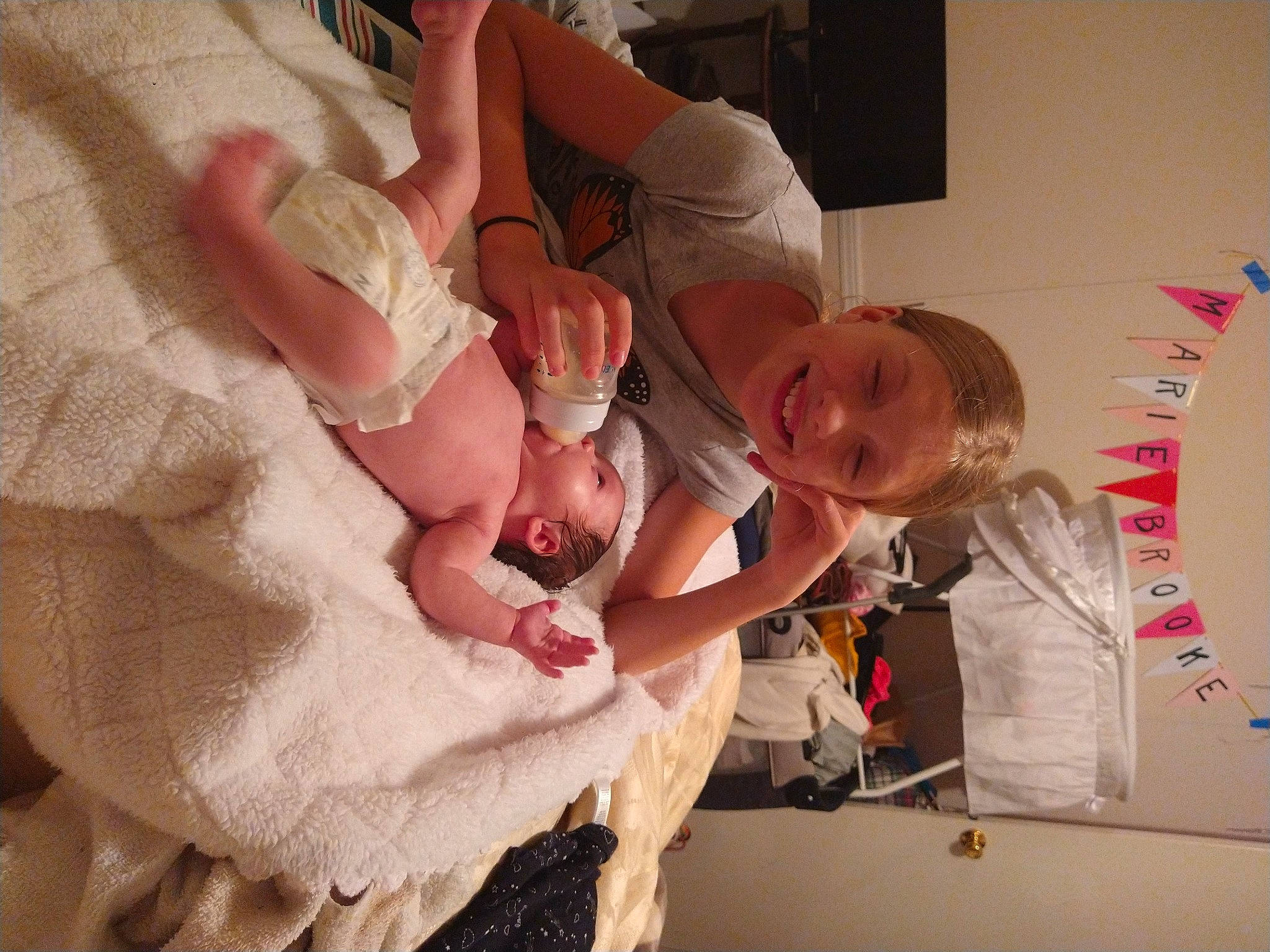 Tiffany Logan is registered to the contest to win money with this photo: arm, baby, birth, child, finger, fun, gesture, hand, joy, person, play, toddler