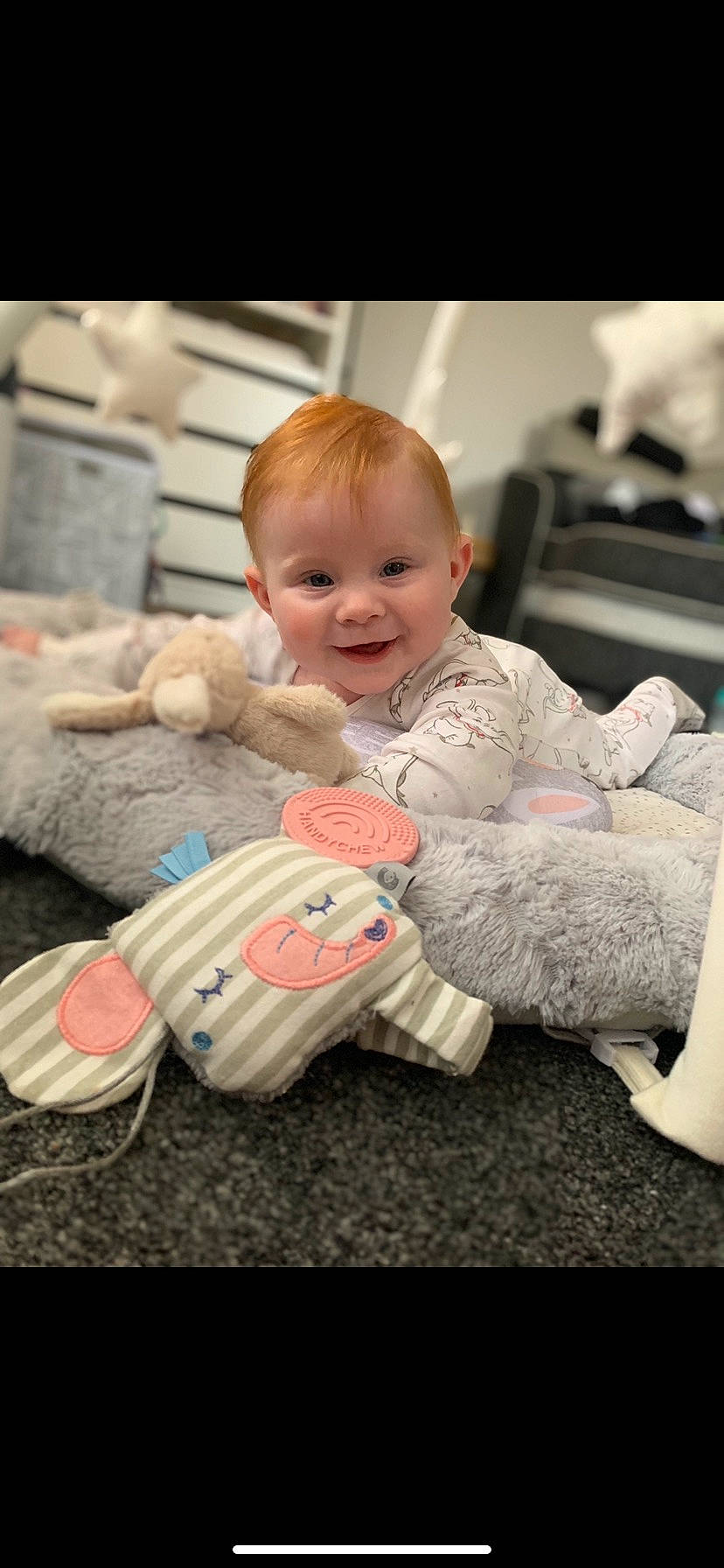 Cassie is registered to the contest to win money with this photo: arm, baby, baby_toddler_clothing, cheek, comfort, couch, electronic_device, facial_expression, finger, hand, happy, joy, leg, mammal, person, product, skin, smile, sock, technology