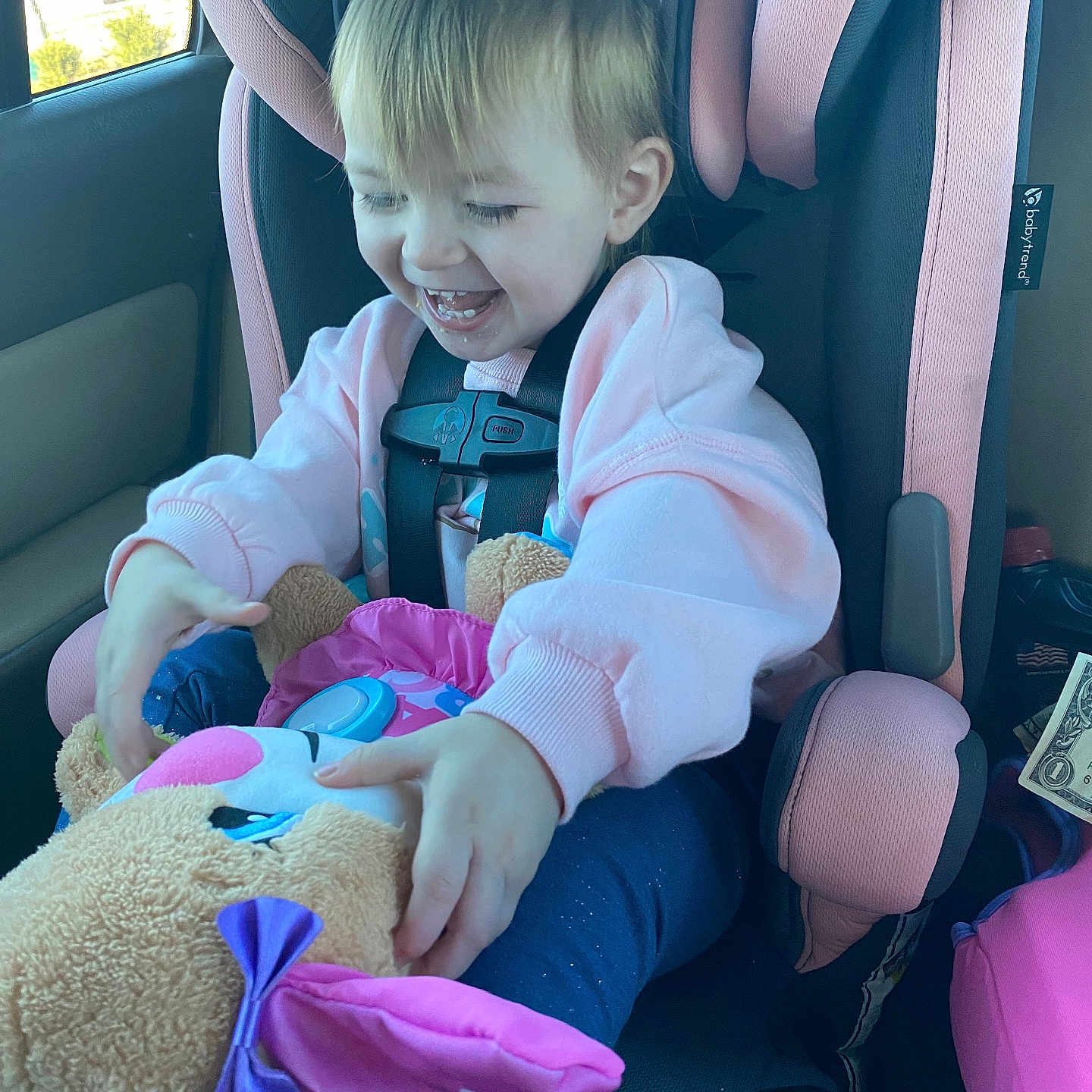 Allison joined the competition — help win amazing prizes! baby, car, car_interior, carseat, clothing, coat, cushion, face, glove, head, homedecor, jacket, person, photography, portrait, purple, sitting, toy, transportation, vehicle