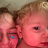 Lucas is registered to the contest to win money with this photo: child, toddler, person, face, smile, blonde_hair, close_up, indoor, butterfly_filter, skin, nose_ring, happy, young_person, candid, casual, vent, light_switch, head, cheek, snuggle