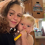 Lucas joined the competition — help win amazing prizes! woman, baby, indoor, smile, face, child, toy, holding, kitchen, cabinet, curly_hair, star_sticker, cheek, blond_hair, diaper, furniture, household_items, portrait, candid, warm_light