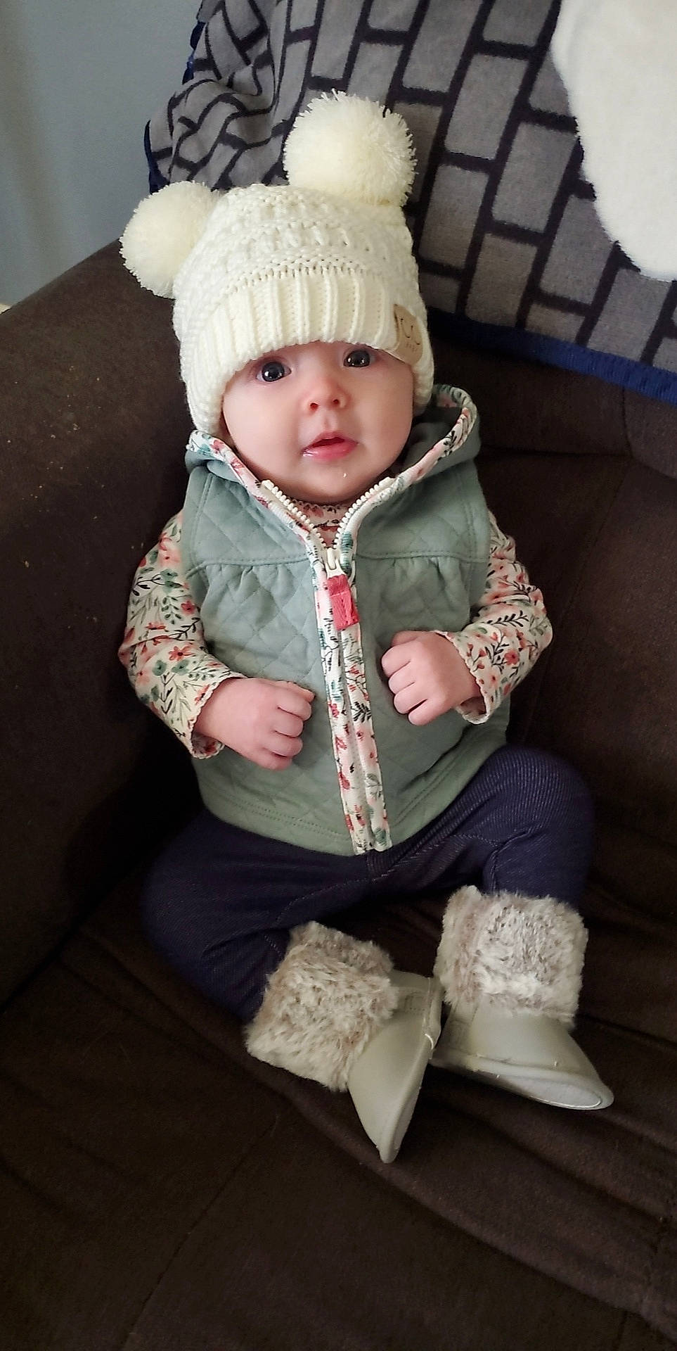 Rylie is registered to the contest to win money with this photo: baby, baby_toddler_clothing, cap, cheek, child, clothing, comfort, fashion_accessory, fur, grass, headgear, headwear, outerwear, pattern, person, pink, sitting, sleeve, thigh, toddler