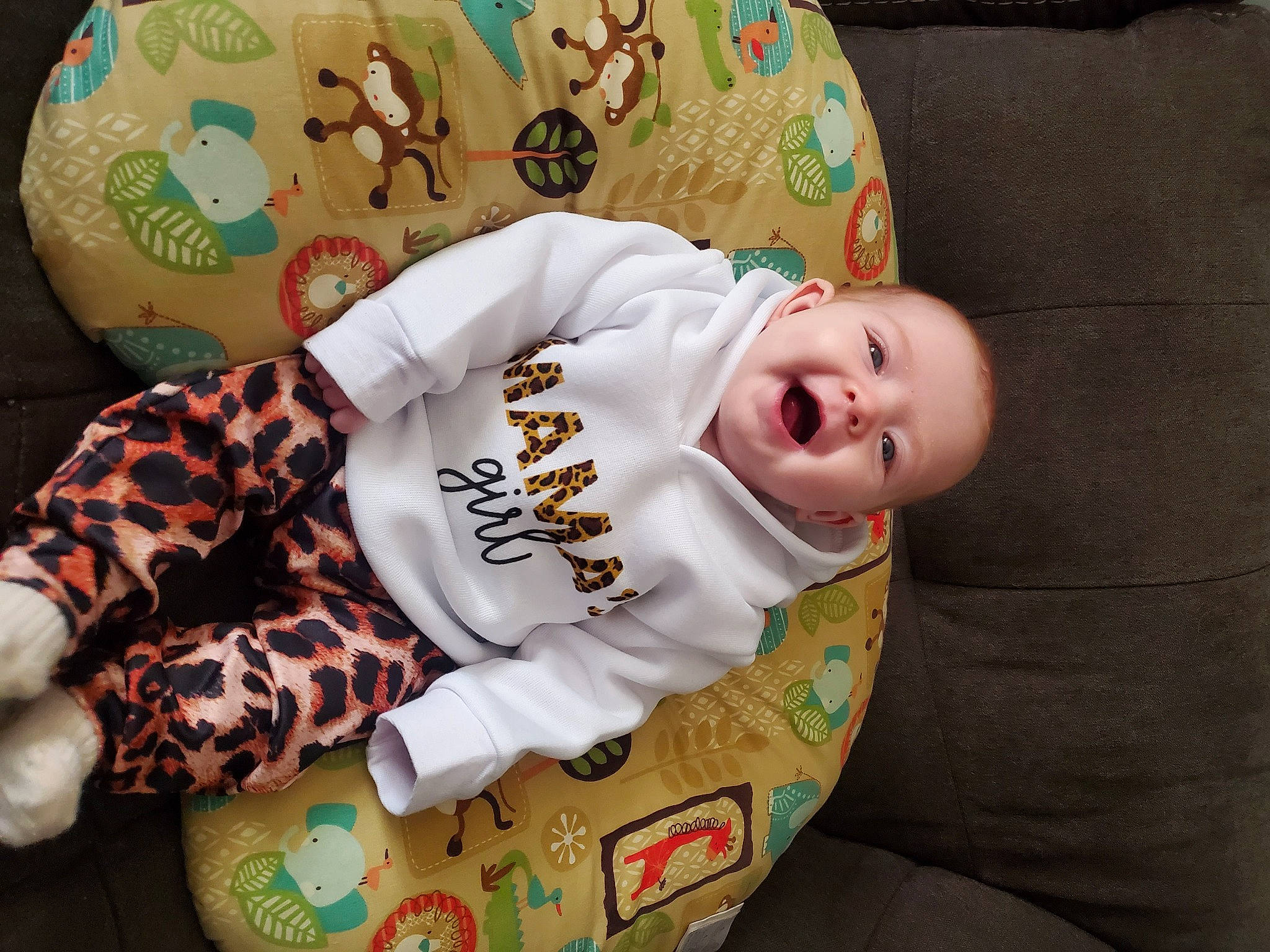 Rylie joined the competition — help win amazing prizes! baby, baby_products, baby_toddler_clothing, cheek, child, comfort, happy, head, headgear, linens, mouth, orange, pattern, person, room, skin, sleeve, smile, t_shirt, textile