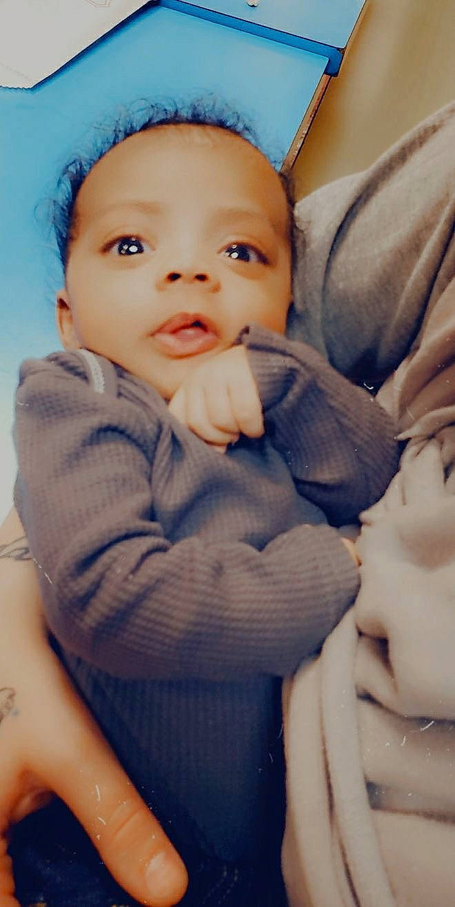 Jayden is registered to the contest to win money with this photo: baby, baby_toddler_clothing, blue, cheek, comfort, eye, eyebrow, face, finger, flash_photography, gesture, happy, head, iris, lip, mouth, nose, person, photograph, skin