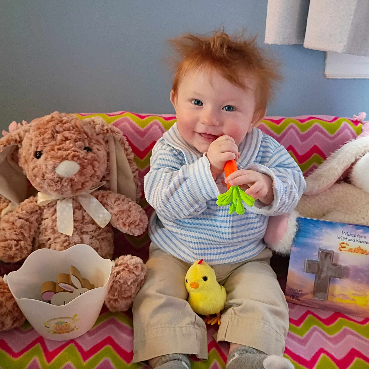 Jamesyn joined the competition — help win amazing prizes! baby, child, plush_toy, stuffed_animal, bunny, carrot_toy, yellow_chick, easter_card, blanket, zigzag_pattern, smiling, indoor, portrait, cute, happy, seated, red_hair, toy, holiday, cozy