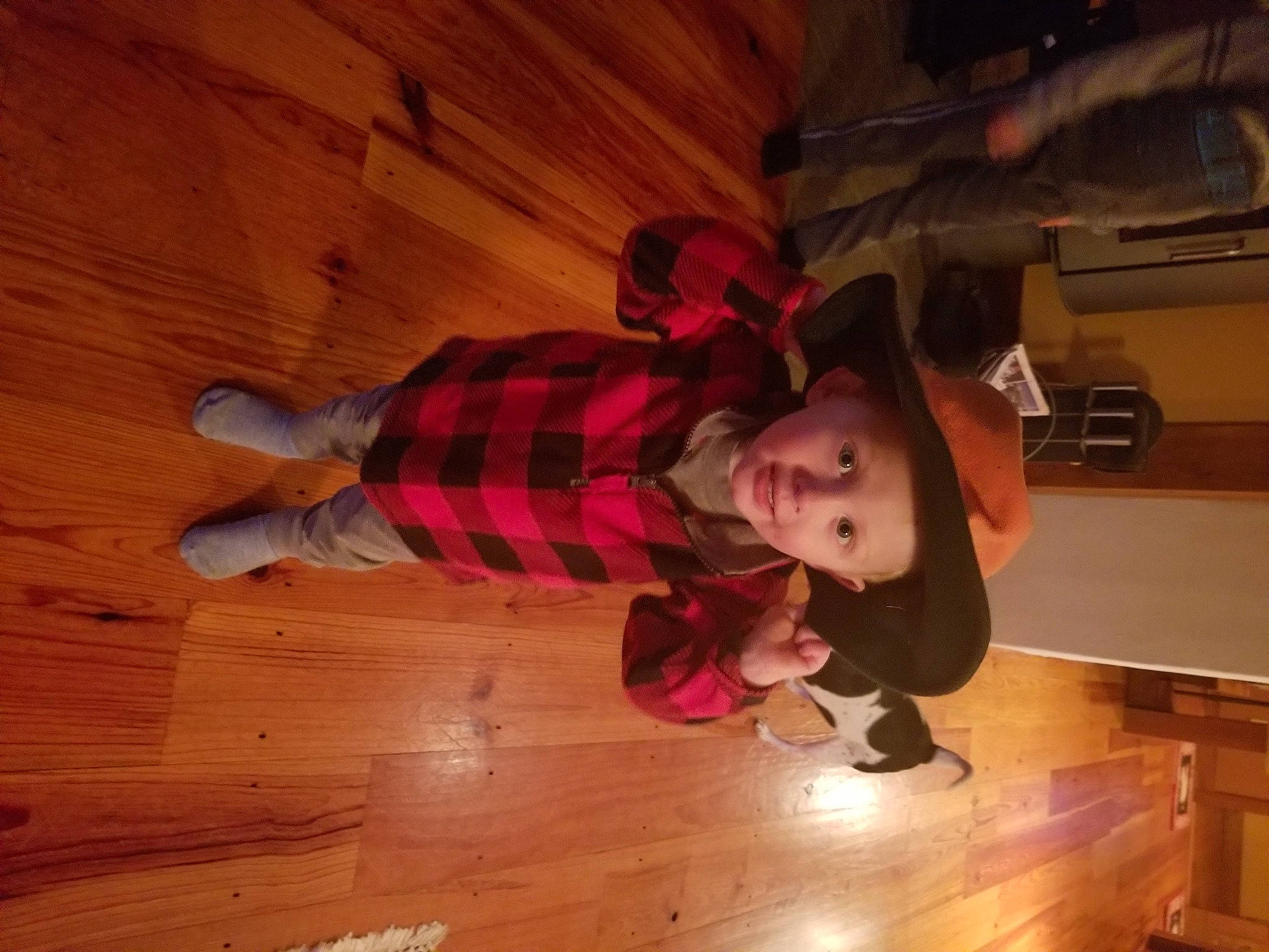 Graceyn is registered to the contest to win money with this photo: baby, baby_toddler_clothing, brown, child, floor, flooring, foot, hardwood, headwear, laminate_flooring, person, plank, play, plywood, sock, toddler, varnish, walking_shoe, wood, wood_flooring