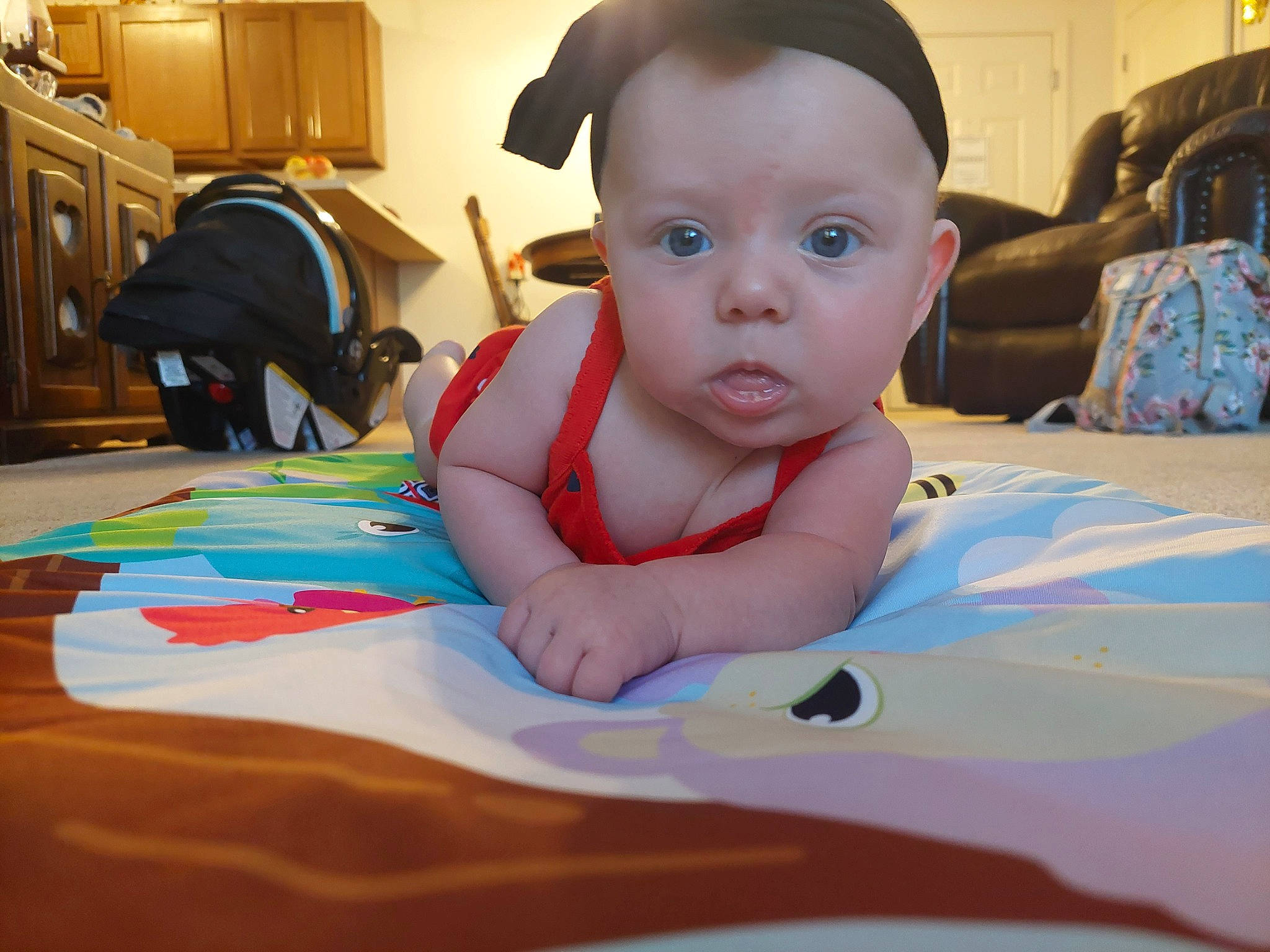 Winter is registered to the contest to win money with this photo: baby, baby_products, baby_toddler_clothing, cabinetry, child, comfort, cupboard, drawer, flooring, fun, happy, hat, home_appliance, leisure, person, play, room, sitting, textile, toddler