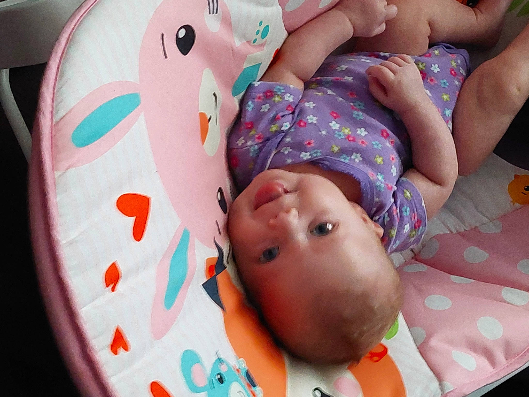 Winter is registered to the contest to win money with this photo: baby, baby_products, baby_toddler_clothing, cheek, child, comfort, facial_expression, finger, fun, happy, leisure, mouth, organ, pattern, person, pink, skin, textile, thigh, toddler