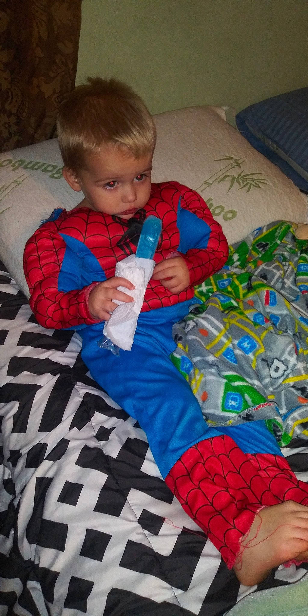 Tre is registered to the contest to win money with this photo: baby, baby_products, baby_toddler_clothing, baby_toys, bedding, blanket, child, fictional_character, linens, nap_mat, pajamas, person, play, quilt, textile, toddler, toy