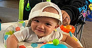 Echo joined the competition — help win amazing prizes! baby, child, smile, cap, baby_walker, toy, indoor, person, adult, kitchen, furniture, carpet, clothing, happy, headwear, home, playtime, cute, infant, man