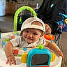 baby, child, smile, cap, baby_walker, toy, indoor, person, adult, kitchen, furniture, carpet, clothing, happy, headwear, home, playtime, cute, infant, man