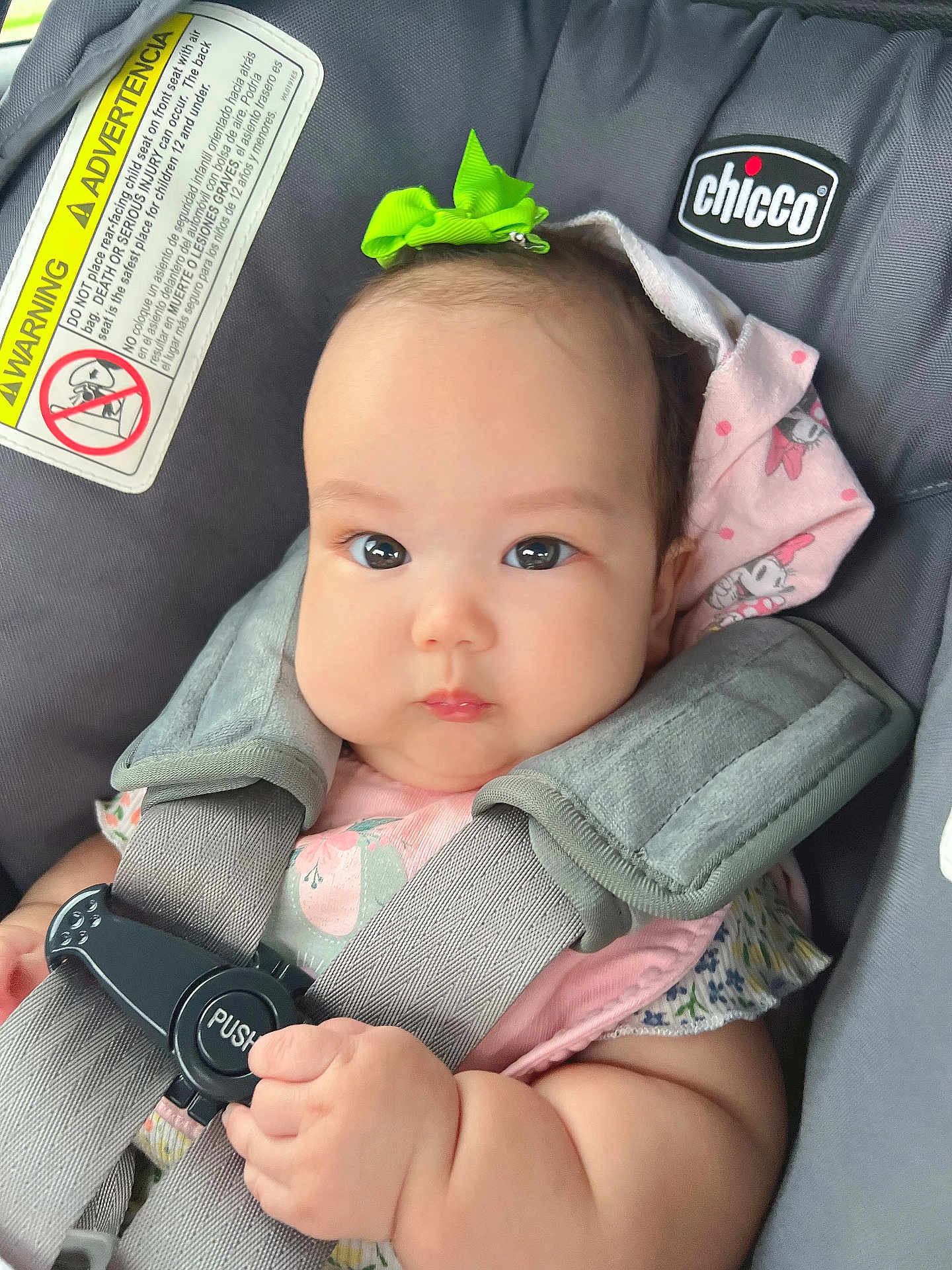 Rhianna joined the competition — help win amazing prizes! baby, infant, child, car_seat, safety_harness, bow, pink_clothing, cute, chubby_cheeks, hand, face, eyes, expression, indoor, photography, child_safety, seat_belt, person, closeup, car