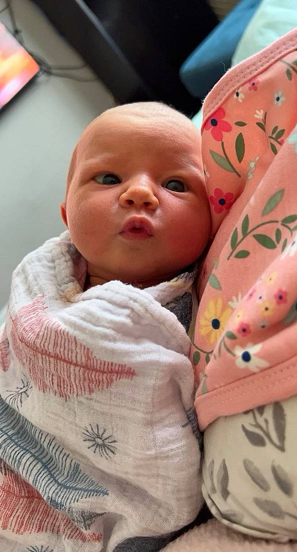 Daisy is registered to the contest to win money with this photo: baby, bedtime, carmine, cheek, child, chin, close_up, comfort, event, eyebrow, happy, linens, lip, mouth, nose, person, pink, room, skin, textile
