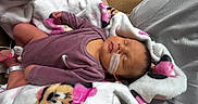 Maylynn joined the competition — help win amazing prizes! baby, bed, blanket, cute, face, hospital_bracelet, indoors, infant, medical_tape, nasal_tube, newborn, onesie, person, pillow, pink, portrait, purple, resting, sleeping, soft_fabric