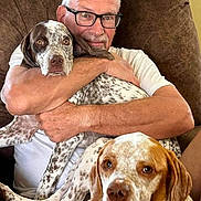 Kenzie is registered to the contest to win money with this photo: affection, animal, brown_chair, canine, casual, companion, cute, dog, friendly, glasses, home, hugging, indoor, man, pet, portrait, relaxing, seated, spotted_dog, white_shirt