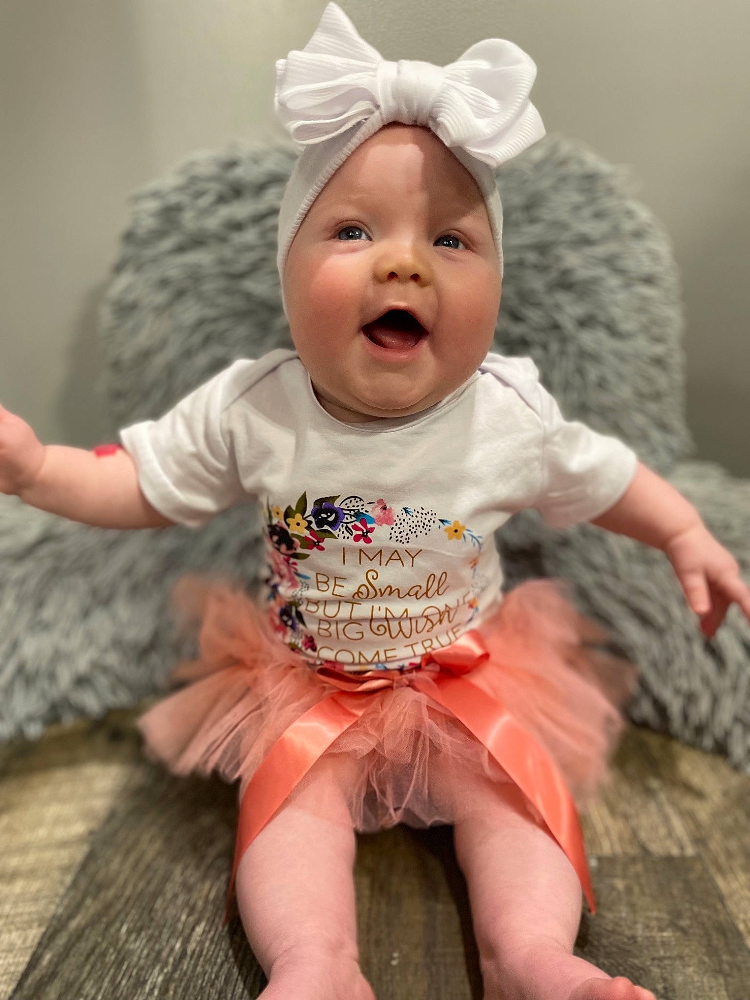 Maci is registered to the contest to win money with this photo: baby, baby_toddler_clothing, cap, cheek, child, face, fashion_accessory, finger, fun, happy, head, headgear, headpiece, headwear, iris, person, pink, skin, sleeve, smile