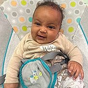 Romi joined the competition — help win amazing prizes! baby, infant, smile, baby_seat, clothing, cute, child, happy, indoors, face, hand, patterned_clothes, seatbelt, plush, comfort, portrait, young_child, baby_toys, playful, colorful