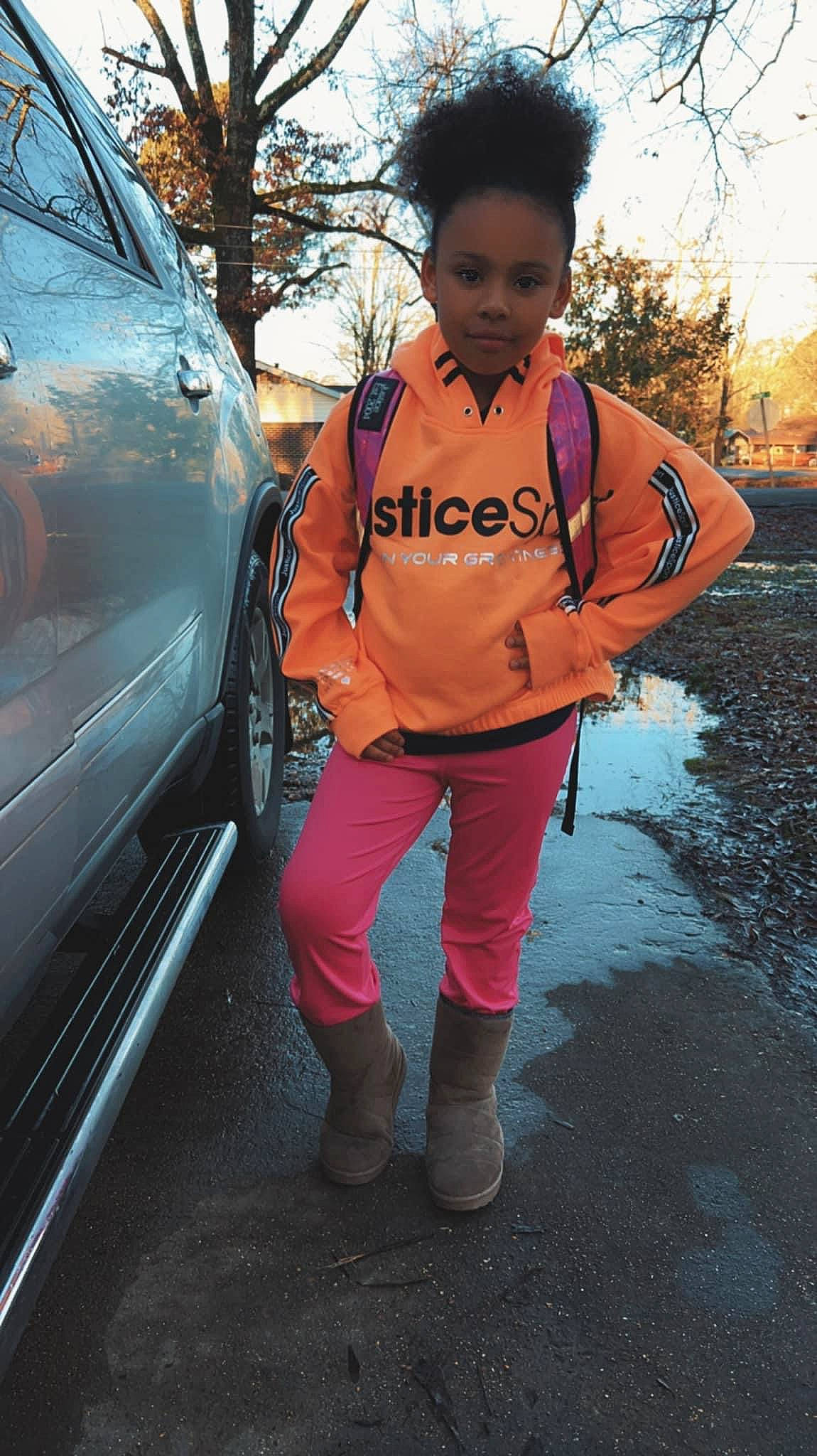 Layla Ariana joined the competition — help win amazing prizes! asphalt, automotive_design, automotive_exterior, automotive_lighting, automotive_tire, bumper, car, electric_blue, family_car, grass, headlamp, hood, jacket, motor_vehicle, person, personal_protective_equipment, rim, road, tire, tree