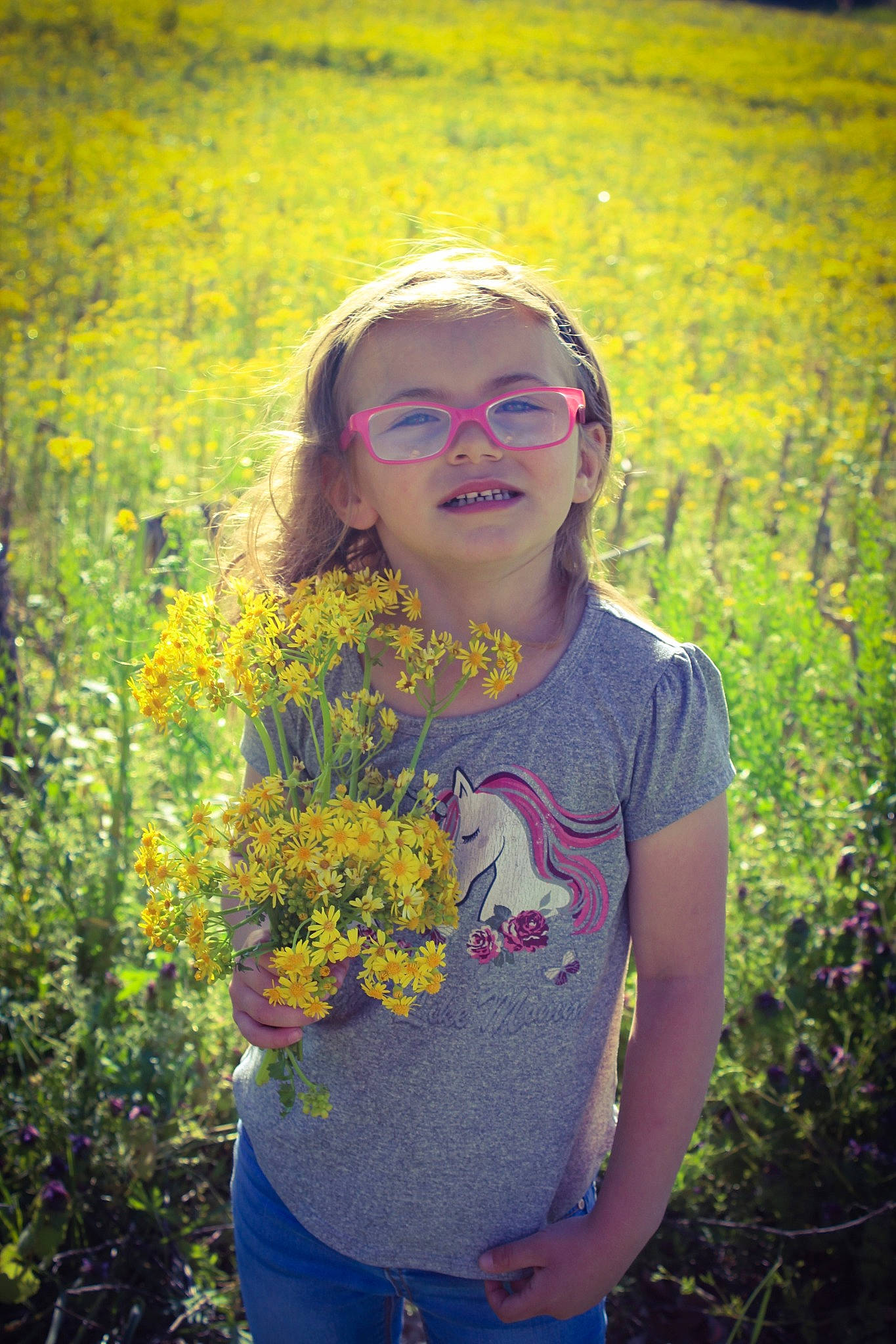 Lucy is registered to the contest to win money with this photo: electric_blue, eyewear, flash_photography, flower, fun, grass, grass_family, grassland, hairstyle, happy, iris, joy, landscape, meadow, natural_environment, people_in_nature, person, plant, prairie, sunlight