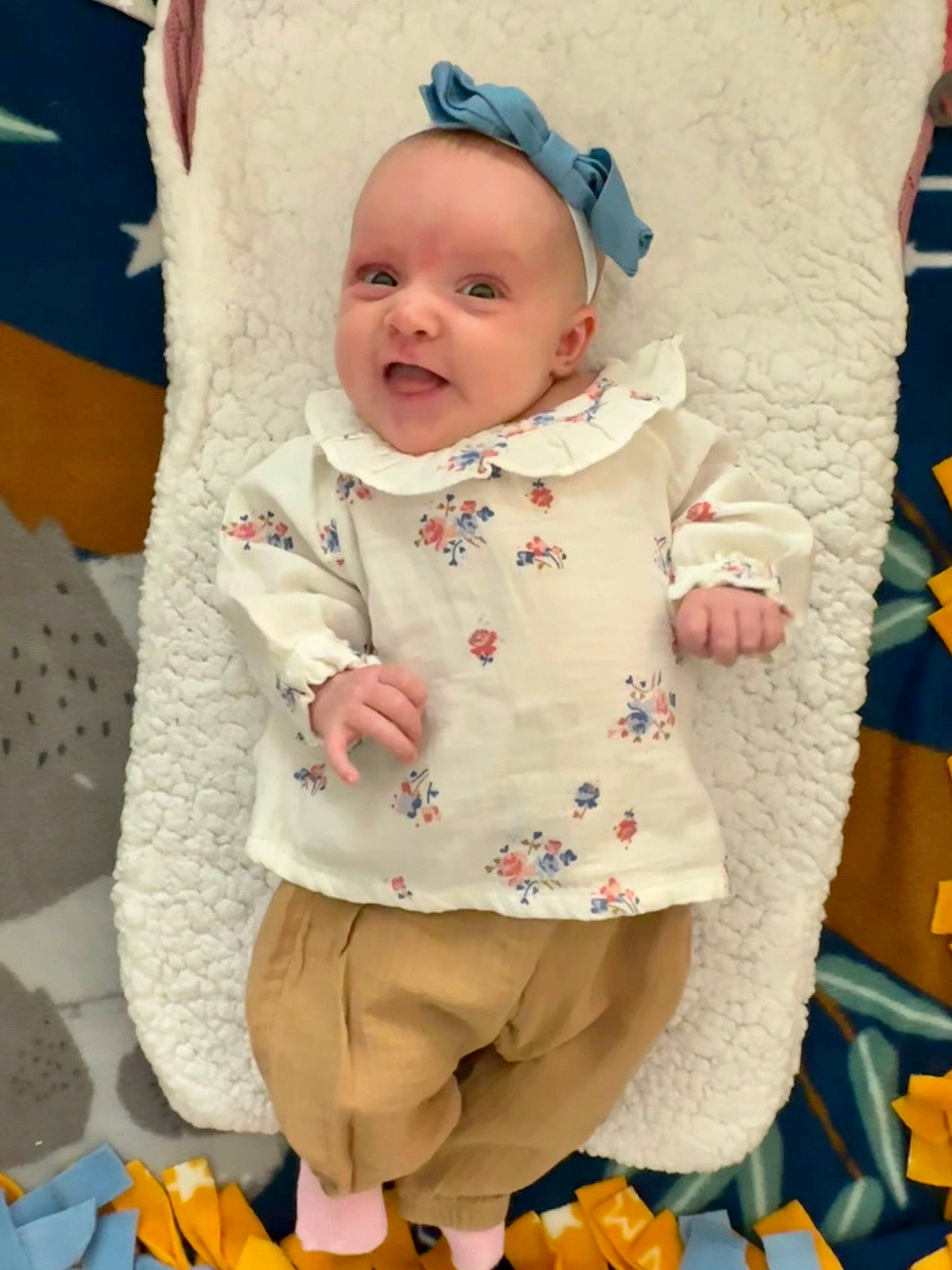 Neveah is registered to the contest to win money with this photo: baby, baby_safety, baby_toddler_clothing, cheek, child, clothing, eye, face, happy, linens, people, person, photograph, product, skin, sleeve, smile, textile, toddler, white