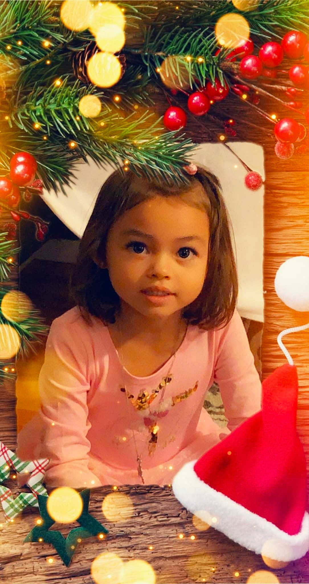 Jasmin is registered to the contest to win money with this photo: beauty, child, christmas_decoration, christmas_ornament, christmas_tree, event, eye, face, fun, green, happy, head, holiday, holiday_ornament, lighting, ornament, people, person, snapshot, sweetness