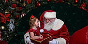 Ivory joined the competition — help win amazing prizes! child, santa_claus, christmas_tree, holiday, red_dress, book, reading, festive, ornaments, glasses, beard, white_gloves, smiling, green_chair, pillow, indoor, celebration, decorations, happy, toddler