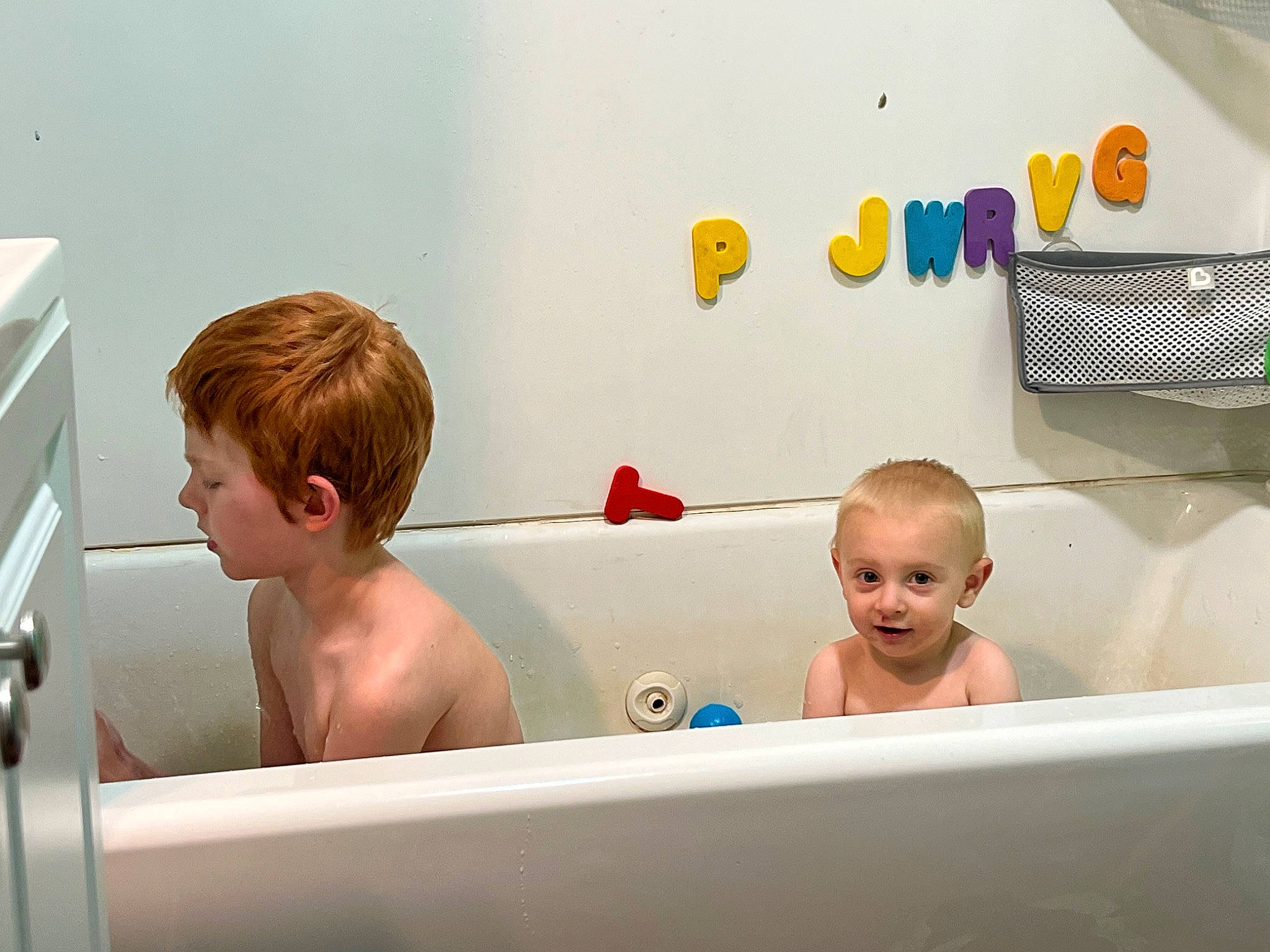 Noè is registered to the contest to win money with this photo: baby, baby_playing_with_toys, bath_toy, bathing, bathroom, bathtub, cabinetry, child, face, fun, happy, leisure, person, play, plumbing, plumbing_fixture, recreation, rectangle, room, smile