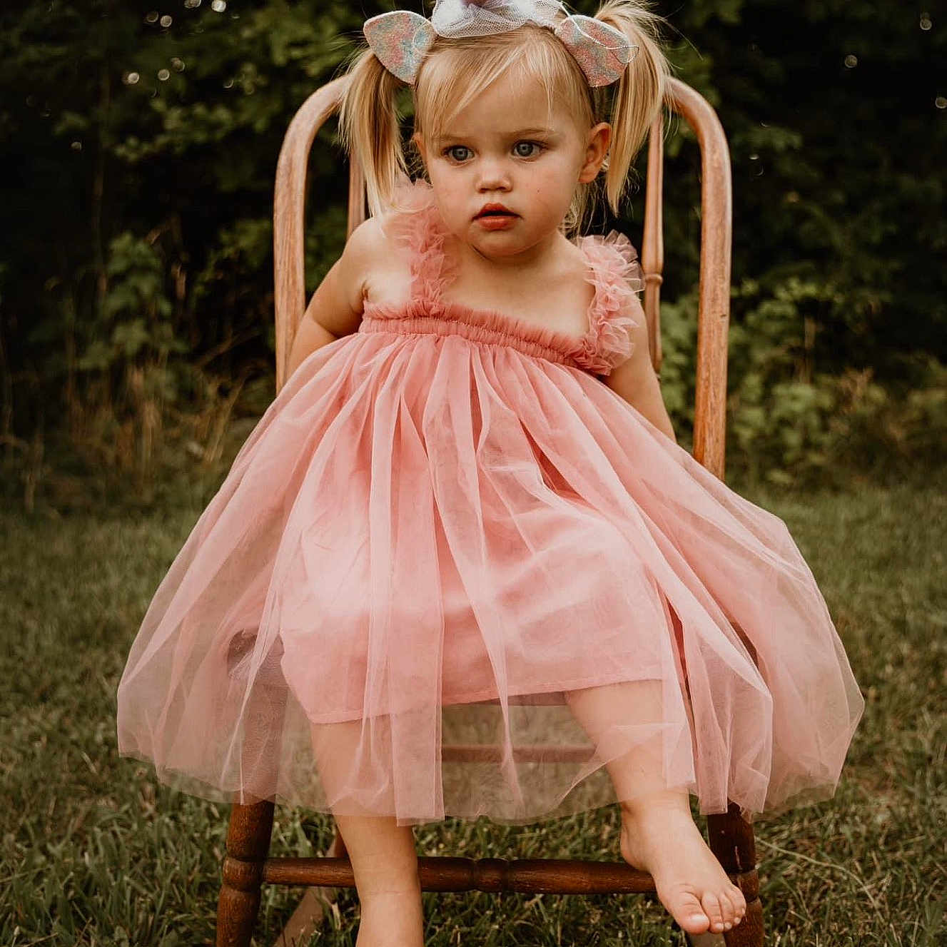 Adley is registered to the contest to win money with this photo: chair, child, clothing, costume, dress, face, female, formalwear, furniture, girl, grass, head, lawn, nature, outdoors, person, photography, plant, portrait, sitting