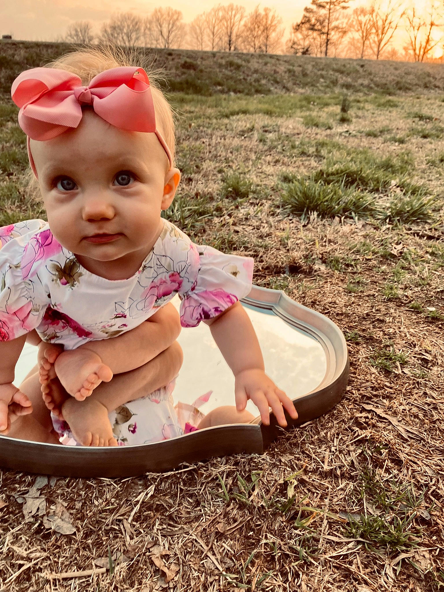 Raelynn is registered to the contest to win money with this photo: baby, baby_toddler_clothing, child, eye, eyewear, fun, grass, happy, headwear, landscape, leisure, pattern, people_in_nature, person, plant, play, recreation, sitting, soil, tints_and_shades