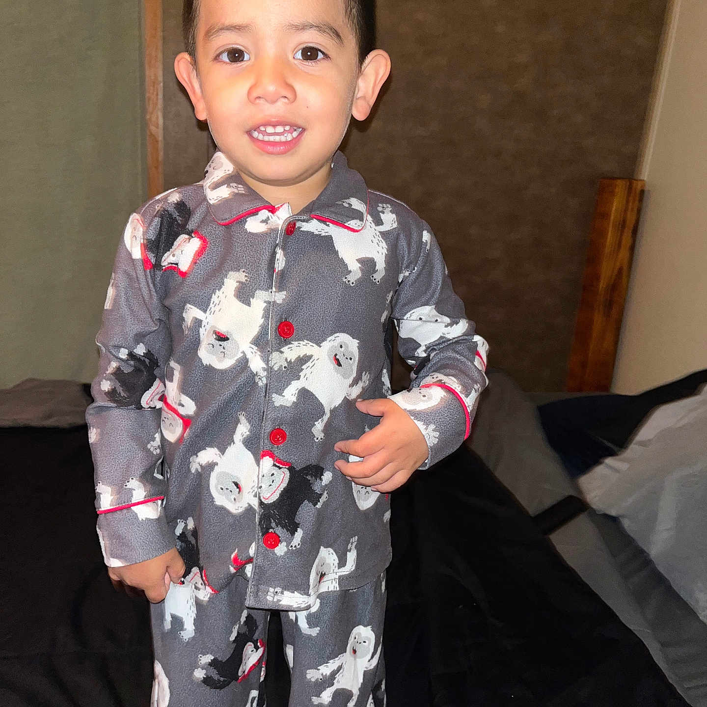 Raul is registered to the contest to win money with this photo: bed, boy, child, clothing, face, formalwear, furniture, head, male, pajamas, person, suit