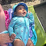 Rosalia is registered to the contest to win money with this photo: baby, child, swimsuit, hat, outdoor, sunhat, towel, hand, holding, lounge_chair, skin, person, legs, face, expression, summer, daylight, cute, infant, sunny
