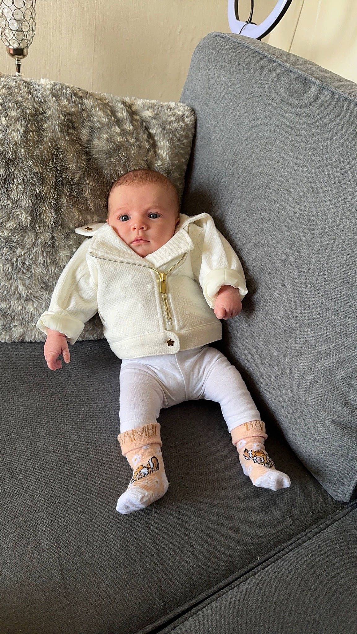 Cataleya participe au concours pour gagner de l'argent avec cette photo : baby, baby_toddler_clothing, chair, cheek, child, comfort, couch, eye, flash_photography, flooring, foot, fur, linens, outerwear, person, room, sitting, skin, sleeve, toddler