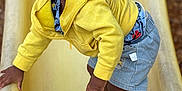 Jayceveon is registered to the contest to win money with this photo: toddler, child, yellow_hoodie, denim_shorts, slide, playground, shoes, curious, outdoor, young_child, portrait, climbing, casual_clothing, shorts, sneakers, daylight, expression, person, activity, fun
