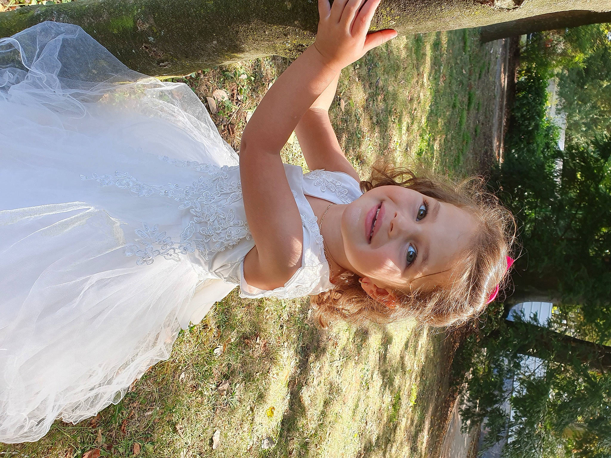 Khadija participe au concours pour gagner de l'argent avec cette photo : bridal_accessory, bridal_clothing, child, event, fun, grass, grassland, green, happy, joy, landscape, leisure, people_in_nature, person, plant, smile, summer, sunlight, tree, vacation