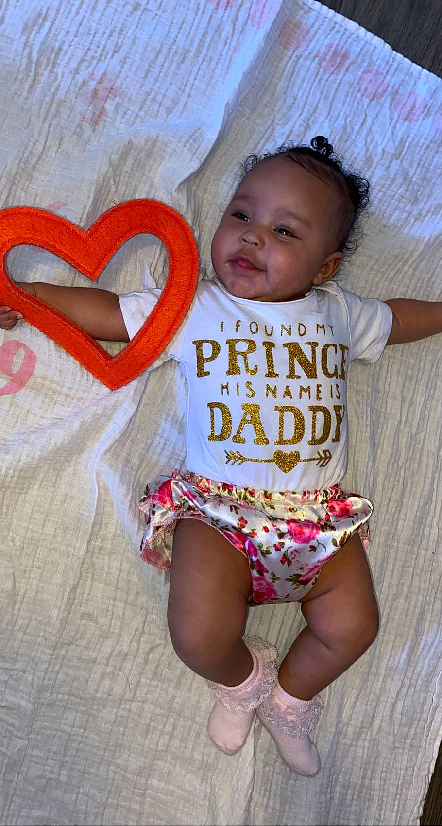 Aviyanna is registered to the contest to win money with this photo: arm, baby, baby_toddler_clothing, chair, child, fashion, finger, hand, happy, human_leg, jewellery, leg, muscle, neck, pattern, person, pink, shoulder, textile, thigh