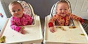 Kaileeanpaisley is registered to the contest to win money with this photo: baby, high_chair, food, toast, avocado, pajamas, smile, happy, messy, indoor, floor, table, feeding, child, cute, two, infant, face, hands, feet