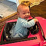 Kaileeanpaisley joined the competition — help win amazing prizes! baby, child, toy_car, pink, blue_clothing, tutu, smile, indoor, car_seat, steering_wheel, floor, rug, trash_bin, wood_floor, person, playful, happy, seat, cute, infant