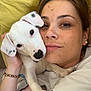 woman, puppy, dog, pet, cuddling, face, earrings, bracelet, bed, pillow, casual, portrait, indoor, closeup, white_dog, spots, happy, relaxed, friendship, skin