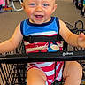 baby, blue_eyes, cart, child, clothing_store, colorful, cute, happy, indoor, infant, person, retail, seat, seatbelt, shopping, shopping_cart, smile, store, striped_outfit, toddler