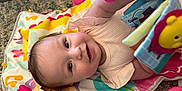 Jazlyn joined the competition — help win amazing prizes! baby, infant, play_mat, toy, soft_toy, colorful, smile, happy, child, carpet, floor, clothing, cute, face, person, indoors, playtime, book, hand, bright