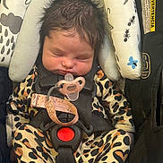 Mia joined the competition — help win amazing prizes! baby, infant, sleeping, car_seat, pacifier, onesie, animal_print, child, safety_harness, cute, indoors, resting, newborn, hair, face, clothing, seat, comfort, toddler, peaceful