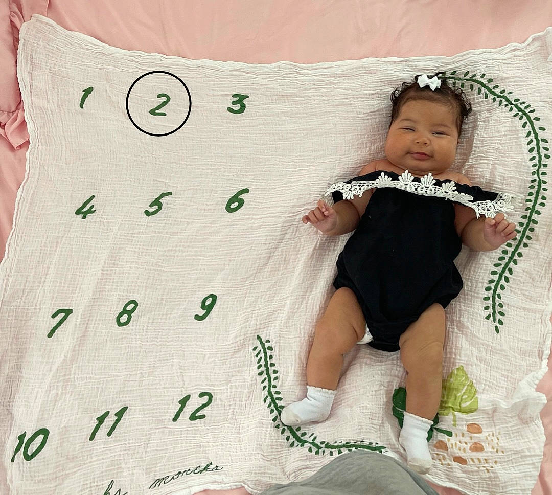 Zaylina joined the competition — help win amazing prizes! baby, baby_sleeping, baby_toddler_clothing, bedding, child, comfort, finger, font, happy, human_leg, linens, pattern, person, product, sleeve, sock, textile, thigh, throw_pillow, toddler