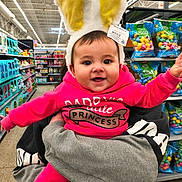 Raven joined the competition — help win amazing prizes! adult_hand, aisle, baby, bunny_ears, child, colorful, happy, headband, holding, infant, person, pink_hoodie, portrait, princess, retail, shelves, shopping, smiling, supermarket, toys