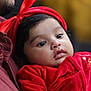 Anette is registered to the contest to win money with this photo: baby, child, red_clothing, headband, red_headband, close_up, portrait, indoor, soft_lighting, adult, face, infant, cute, warm_colors, plush_fabric, holding, mustache, casual_wear, thoughtful, young_child