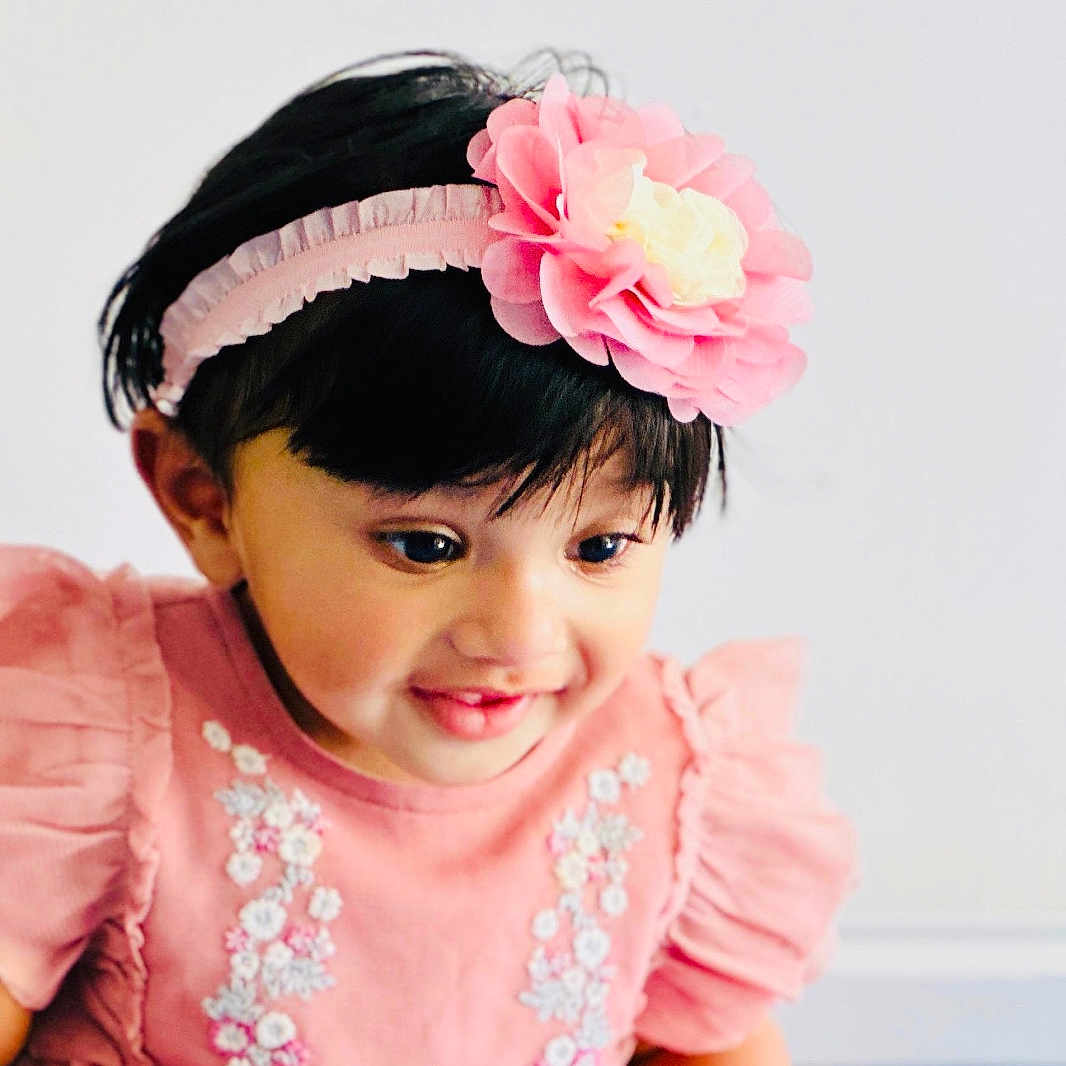 Anette joined the competition — help win amazing prizes! baby, child, closeup, cute, cute_expression, embroidery, fashion, flower, happy, headband, headwear, indoors, infant, person, pink_dress, playful, portrait, smiling, toddler, young_child
