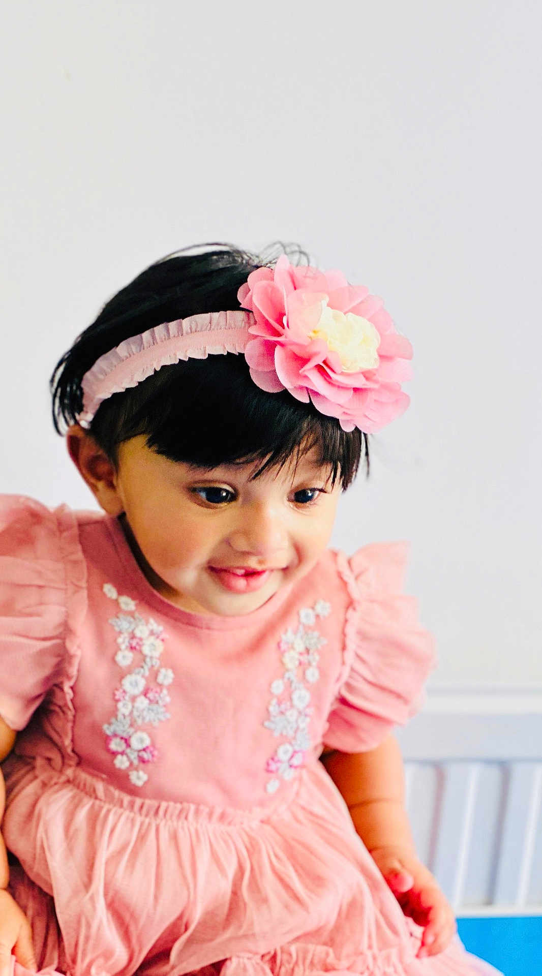 Anette joined the competition — help win amazing prizes! toddler, child, pink_dress, headband, flower, smiling, portrait, cute, young_child, embroidery, happy, indoors, fashion, person, baby, headwear, cute_expression, closeup, infant, playful